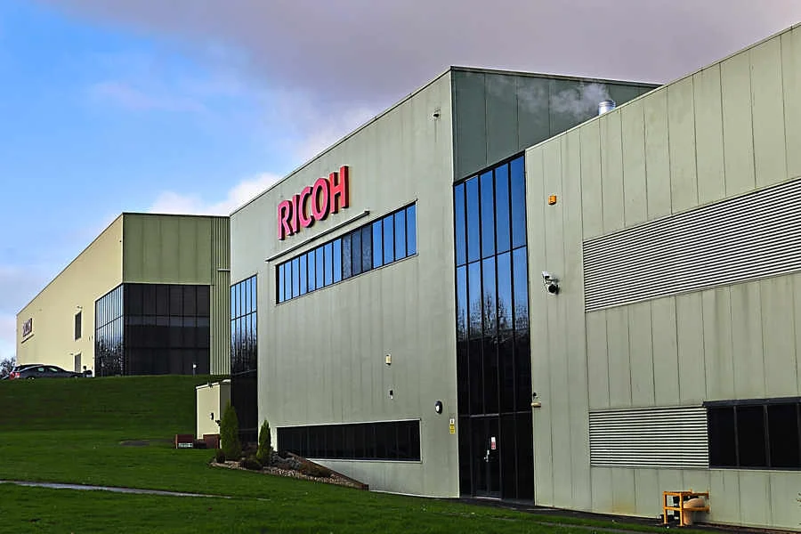 Ricoh office building exterior, modern architecture, large windows, green landscape, corporate headquarters